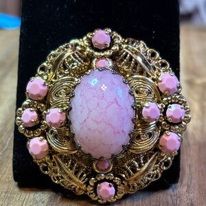 Ornate gold tone pink glass brooch (West Germany?)